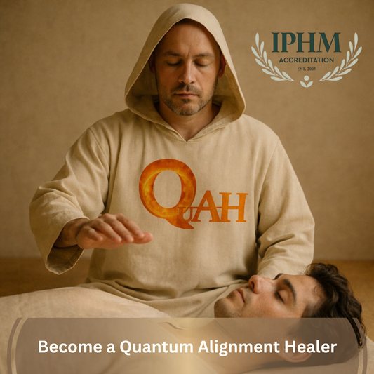 Man in a hooded outfit with 'QuAH' logo performing a healing gesture on another person, with IPHM accreditation logo in the corner.