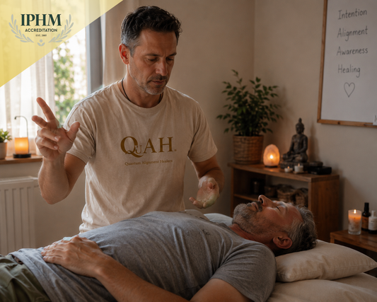 Quantum healing practitioner performing an energy healing session during QuAH training.